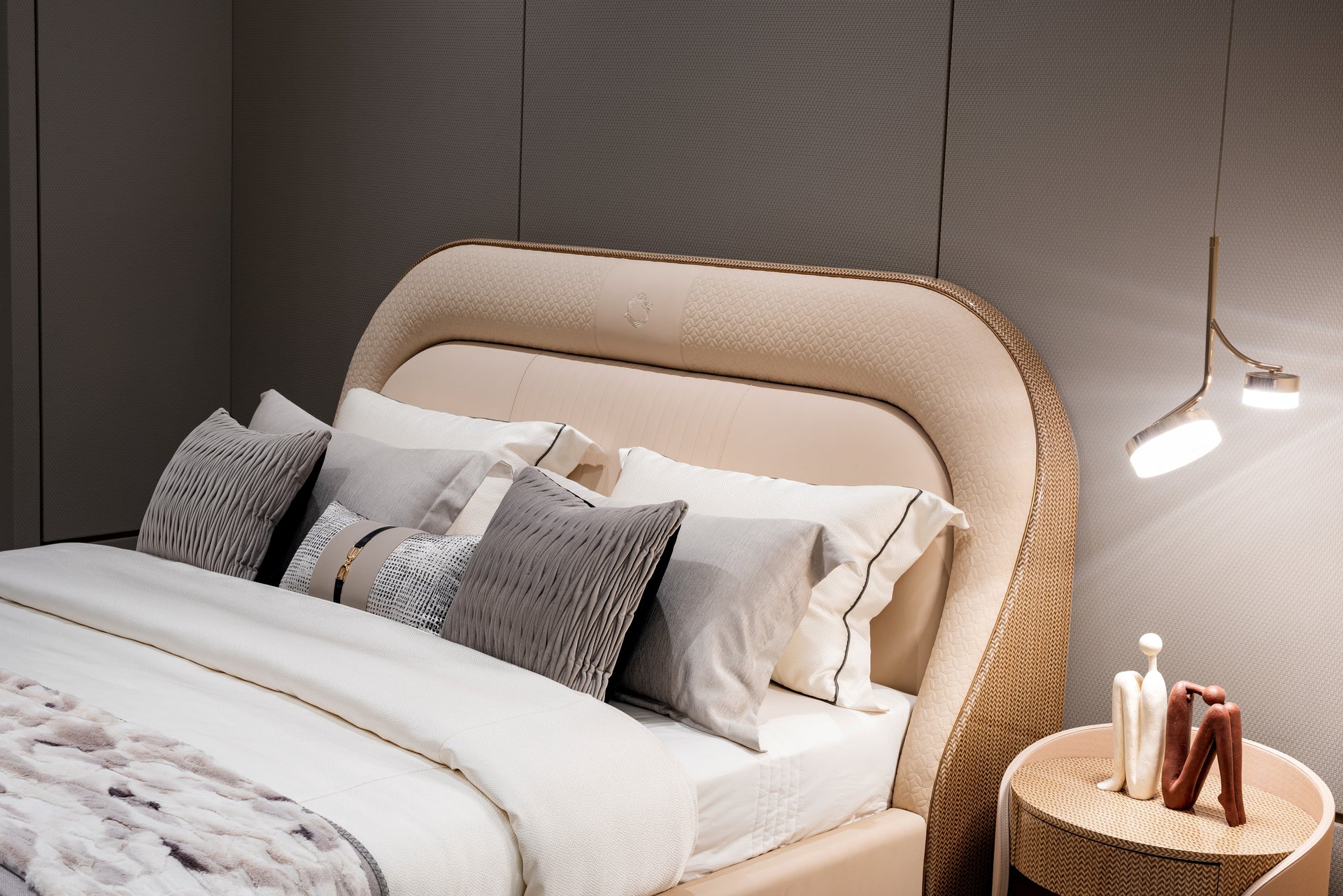 AK-P012 – Sculpted Leather Bed with Curved Headboard and Gold Base